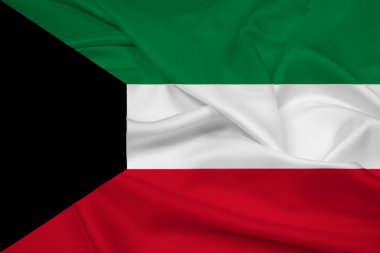 Kuveyt bayrağı sallayarak