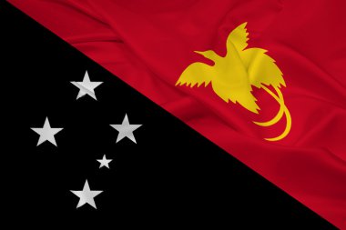 Papua Yeni Gine bayrağı sallayarak