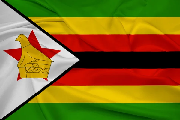 Macha flagą zimbabwe — Zdjęcie stockowe