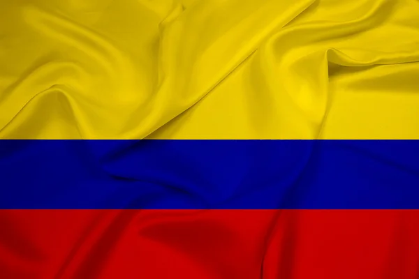 Viftar med colombia flagga — Stockfoto