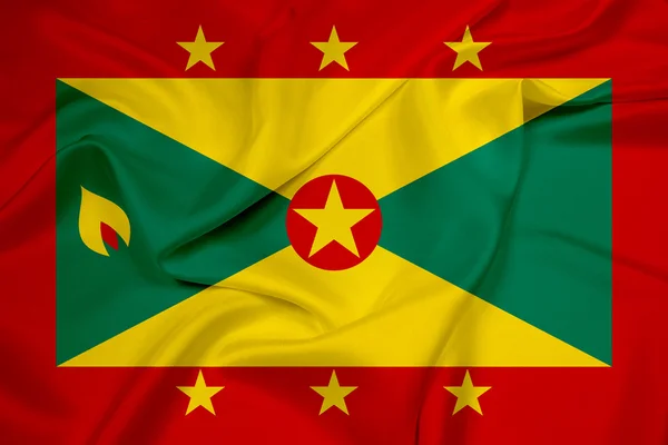 Grenada bayrağı sallayarak — Stok fotoğraf