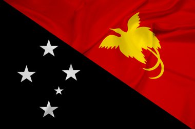 Papua Yeni Gine bayrağı sallayarak