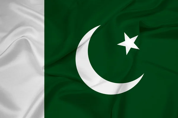 Machanie flagą Pakistanu — Zdjęcie stockowe
