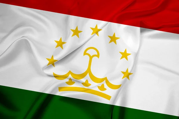 Tacikistan bayrağı sallayarak — Stok fotoğraf