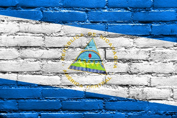 Nicaragua flaggan målad på tegelvägg — Stockfoto