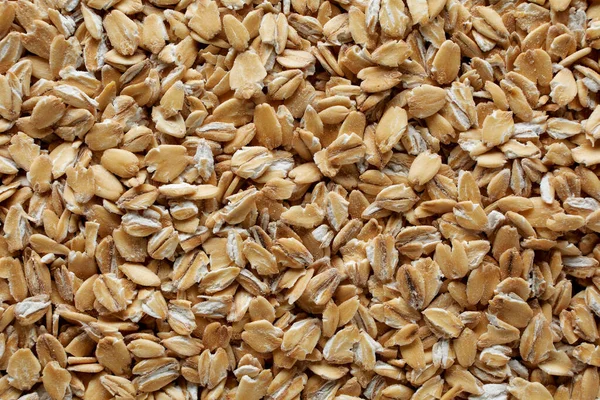 Oatmeal flakes close up as background. healthy food — Stock Photo, Image