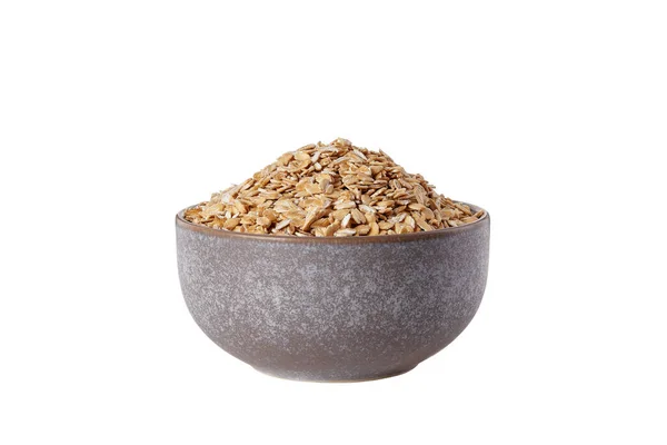 Oatmeal in a plate uncooked on white background isolated — Stock Photo, Image