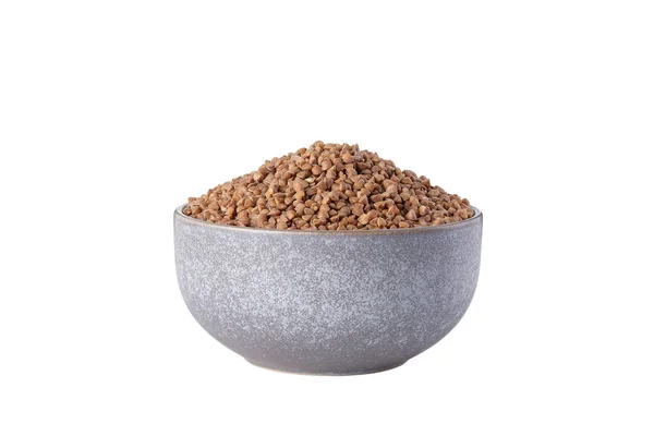 Raw buckwheat in bowl on white background isolated — Stockfoto
