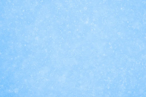 La superficie chiara di ghiaccio azzurro in gelo leggero e irregolarità scongelate. Contesto — Foto Stock