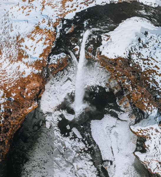 View from flying drone of Kvernufoss watterfall. Amazing winterscene of pure water river in Iceland, Europe. Beauty of nature concept background. — Stock Photo, Image