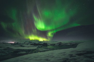 Northern Lights and Aurora Borealis over Joekulsarlon Glacier Lagoon in South Iceland
