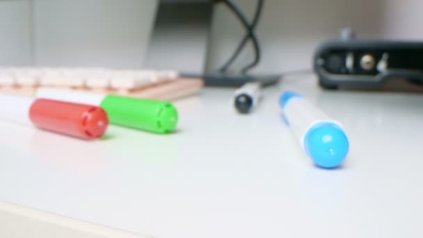 Detailed extreme close-up, multi-colored markers, computer keyboard and audio card on a desk — Video Stock