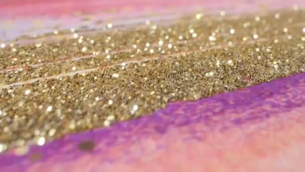 Abstract textured pink and gold glitter background. extreme close-up detailed — Stockvideo