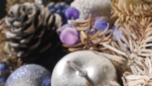 Extreme close-up detailed christmas composition with candles and dried pine branches — Video