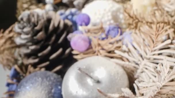 Extreme close-up detailed christmas composition with candles and dried pine branches — Stock video