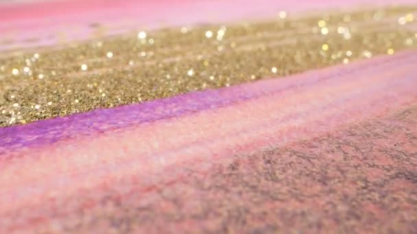 Abstract textured pink and gold glitter background. extreme close-up detailed — Stock videók