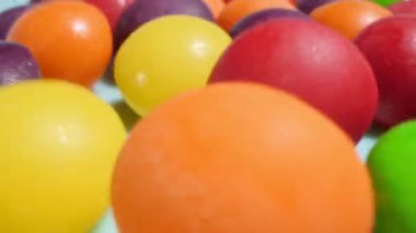 food background. extremely close-up detailed plan of multi-colored small round candies. copy space