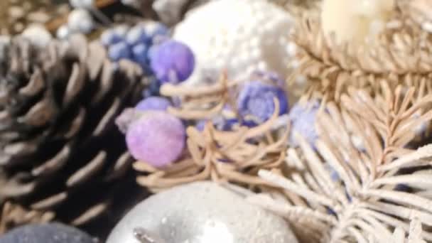 Extreme close-up detailed christmas composition with candles and dried pine branches — Stock video