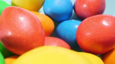 extremely close-up detailed plan. small colorful oval candies