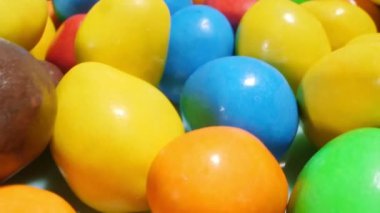 extremely close-up detailed plan. small colorful oval candies