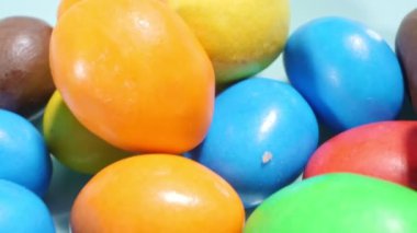 extremely close-up detailed plan. small colorful oval candies.