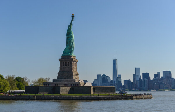 View of the Statue of Liberty and the New York City Skyline.