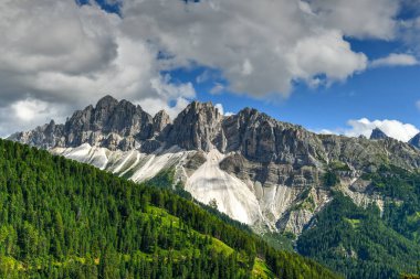 Landscape of the Dolomites and a view of the Aferer Geisler Mountains in Italy.