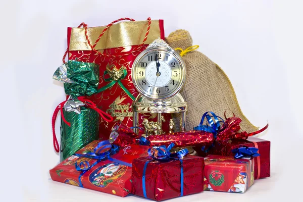 Christmas gifts and clock — Stock Photo, Image