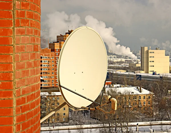 Satellite antenna on the wall — Stock Photo, Image