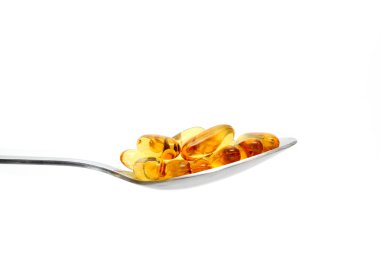 metal kaşık içinde ilaç kapsül