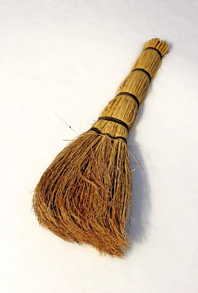 Besom on snow — Stock Photo, Image