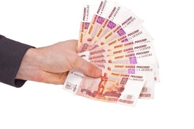 Many Russian rubles banknotes in a man's hand clipart