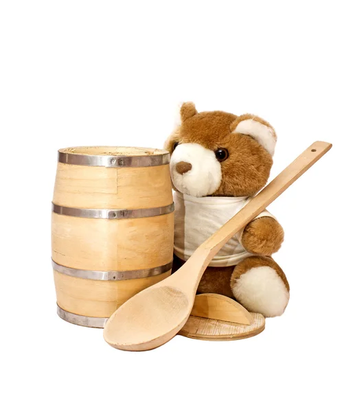 Teddy bear with the keg of honey and a big wooden spoon — Stock Photo, Image