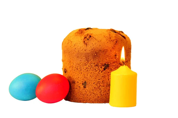 Easter cake, holiday colored eggs and a burning candle — Stock Photo, Image