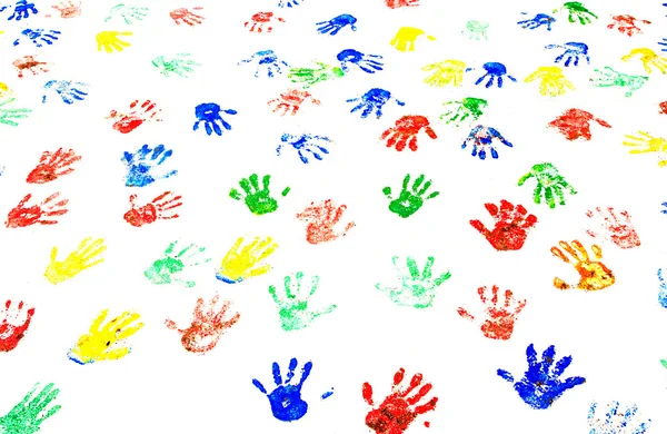 A fehér falon handprints tarka — Stock Fotó