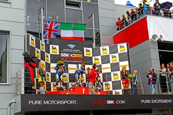 MOSCOW - JULY 21: Russian stage of the Superbike World Championship, Award ceremony, Podium: 1. Marco Melandri, 2. Chaz Davies, 3. Ayrton Badovini, on July 21, 2013, in Moscow Raceway, Moscow, Russia. — Stock Photo, Image