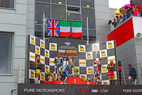 MOSCOW - JULY 21: Russian stage of the Superbike World Championship, Award ceremony, Podium: 1. Marco Melandri, 2. Chaz Davies, 3. Ayrton Badovini, on July 21, 2013, in Moscow Raceway, Moscow, Russia. — Stock Photo, Image