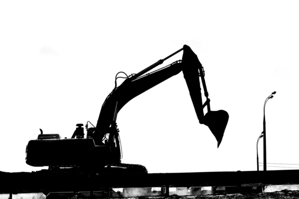 Silhouette works excavator — Stock Photo, Image