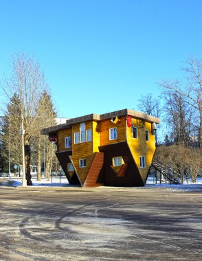 Upside down house in the Russian Exhibition Center in Moscow clipart