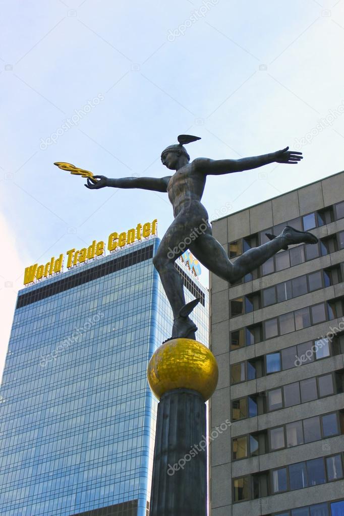 Statue of Mercury on the background of building the World Trade