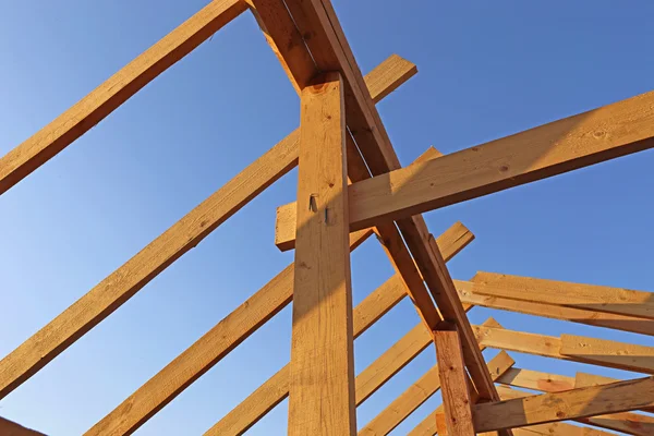 Installation of wooden beams at construction of frame house — Stock Photo, Image