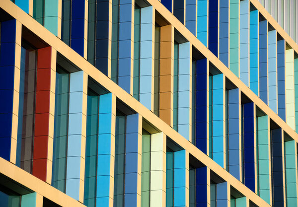 A shot showing the colourful window frames of a block of flats