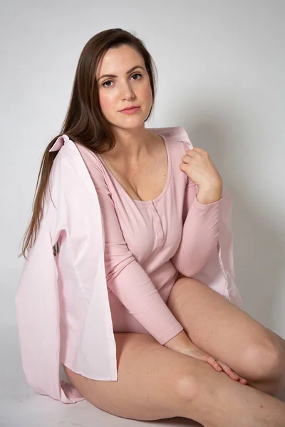 European Woman Pastel Pink Clothes Sitting Dark Hair Isolated Grey — Stock Photo, Image