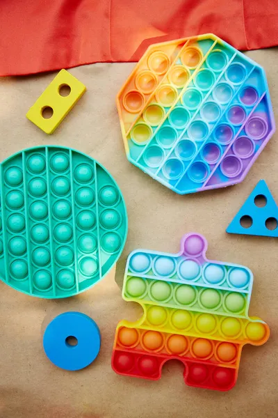New trendy silicone toy. Rainbow sensory fidget. Colorful antistress sensory toy fidget pop it toy. Antistress trendy pop it toy.