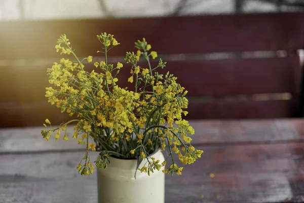 Spring Yellow Flowers Wooden Table Yellow Iron Can Copy Space — стоковое фото