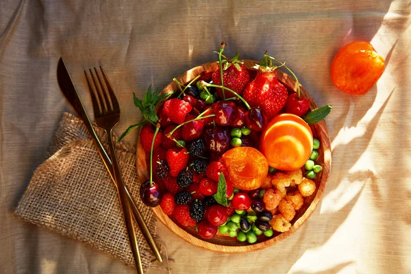 Wooden Plate Seasonal Fruits Berries Background Hard Shadows Strawberries Apricots — Foto de Stock