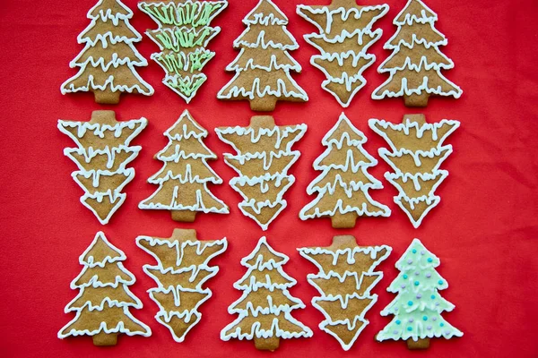 Christmas homemade gingerbread christmas tree cookies close up. One different. Handmade baking background. Festive card with aesthetic Christmas atmosphere. Merry Christmas and home coziness concept.