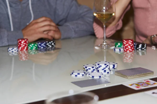 Poker game with friends with chips, cards. Enjoying the moment, digital detox with friends. Selective focus
