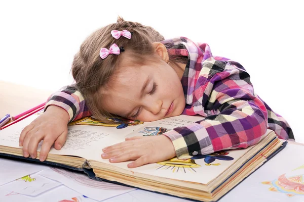 Dormir niño en un libro Fotos de stock