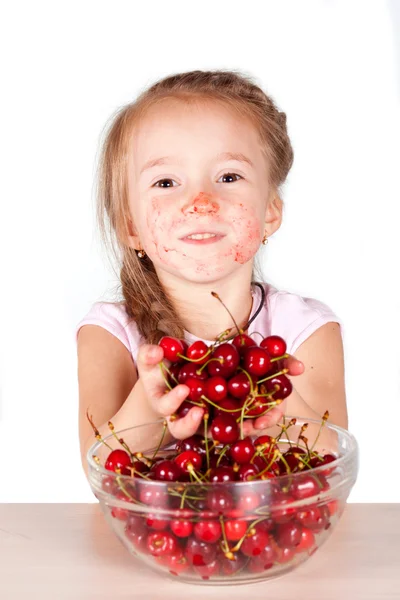 A child with a bowl fresh cherry Stock Image